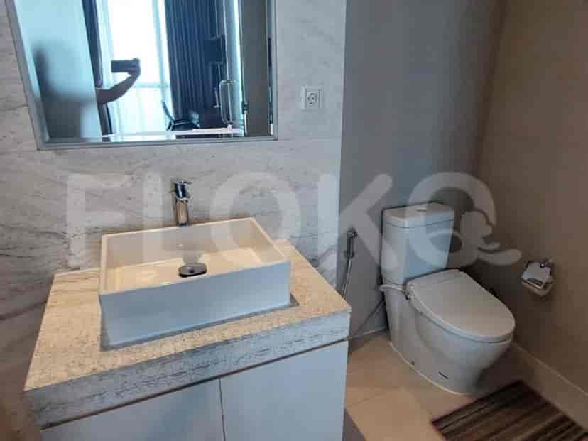 Bathroom featuring a modern sink and toilet.