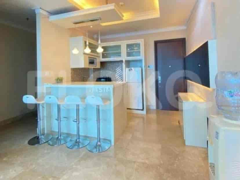Modern kitchen with a breakfast bar and built-in appliances.