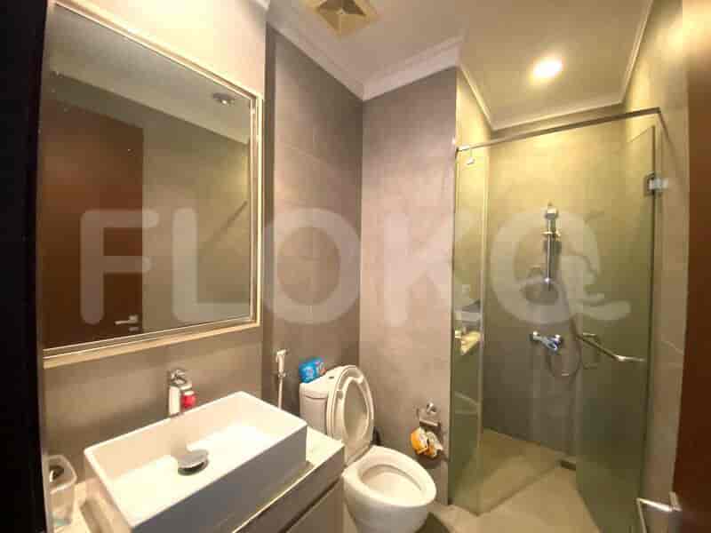 Modern bathroom with a toilet and shower.