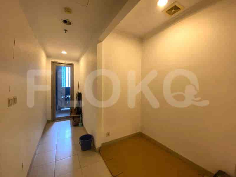 Long hallway with doors and a view of the interior.