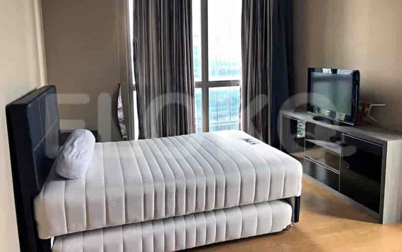 Bedroom with a pull-out bed, TV, and a view of the city.