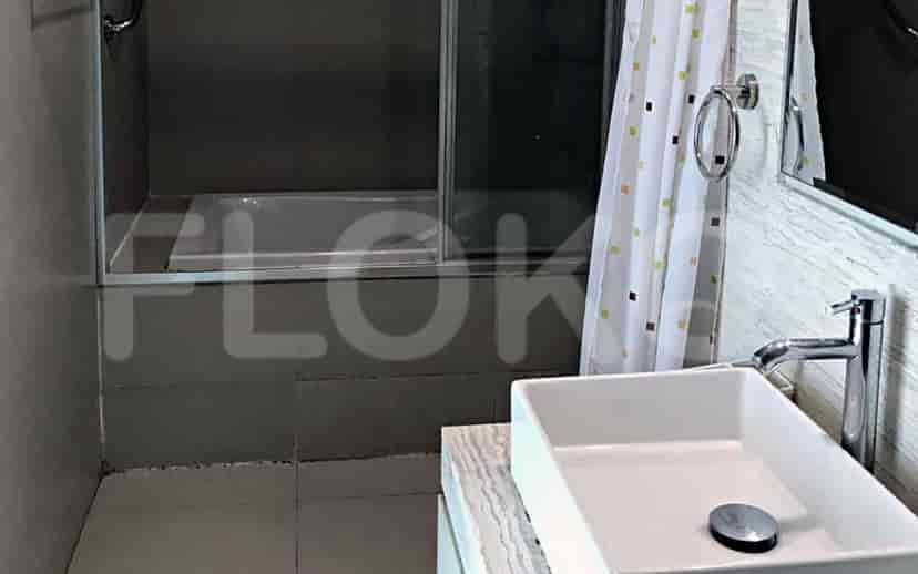 Contemporary bathroom with a bathtub, sink, and shower combination.