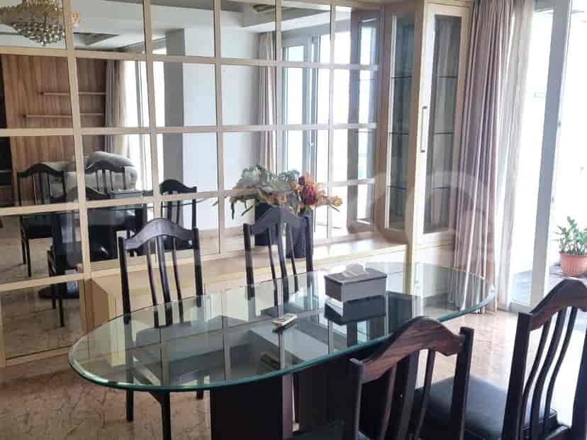 Living room with dining area and views of the balcony.