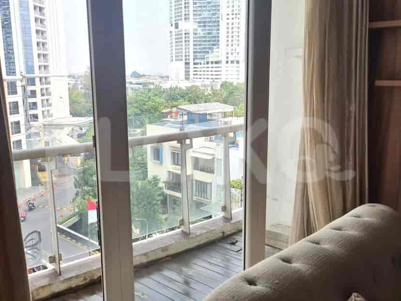 Balcony with a view of the city and surrounding buildings.