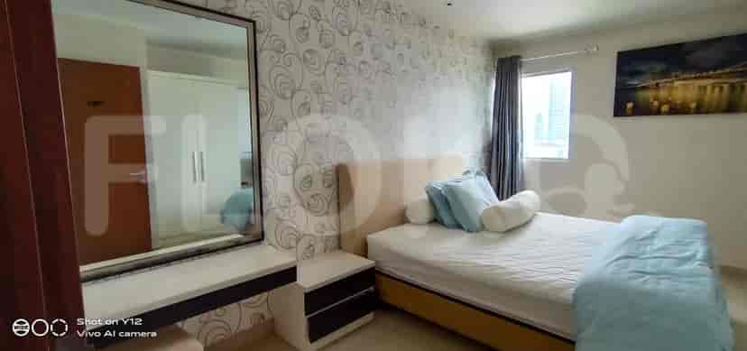Another bedroom angle, highlighting a bed and dressing table.