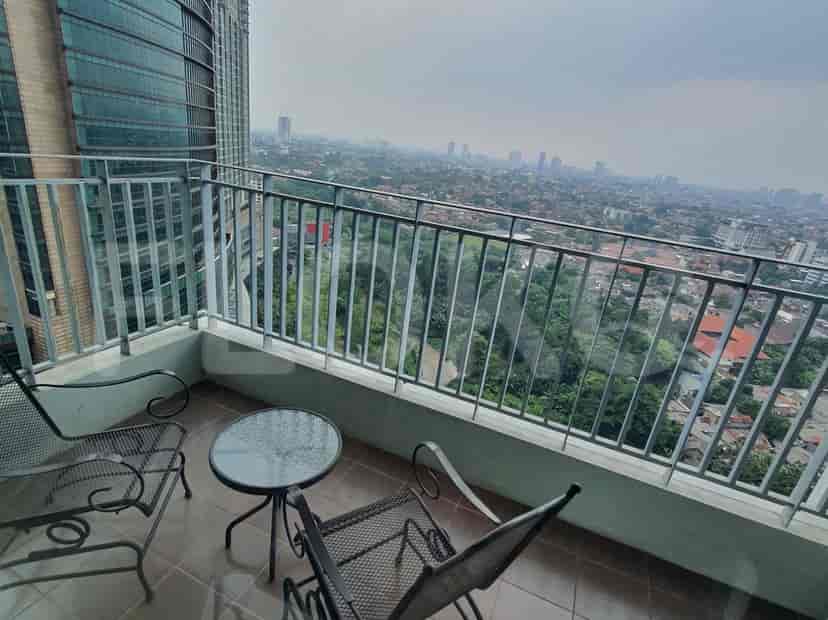 Balcony with city views and outdoor seating.