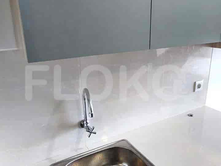 A bathroom with a sink and a shower.