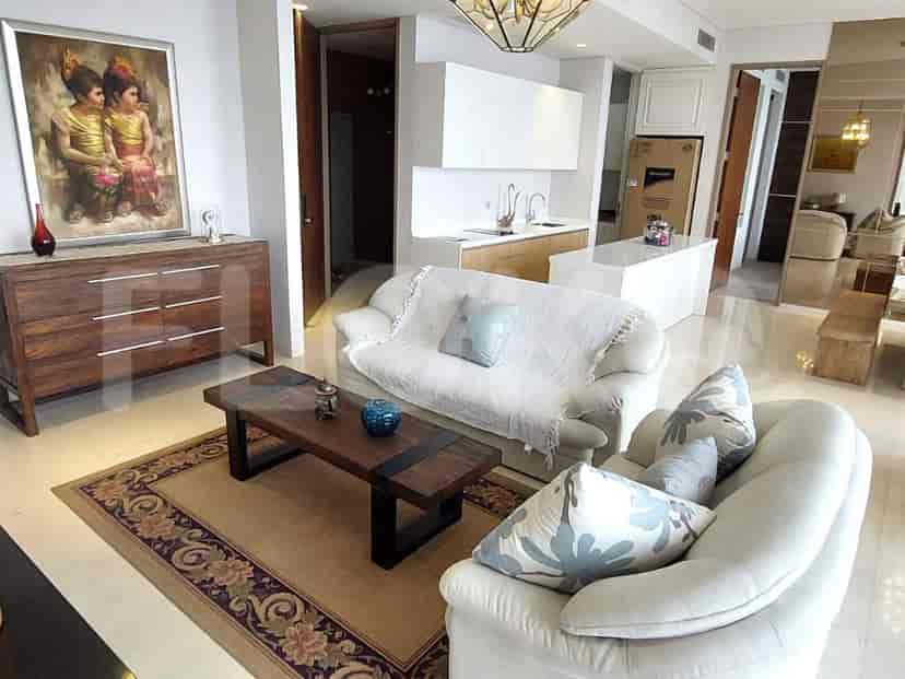 Living room with sofa and a painting.