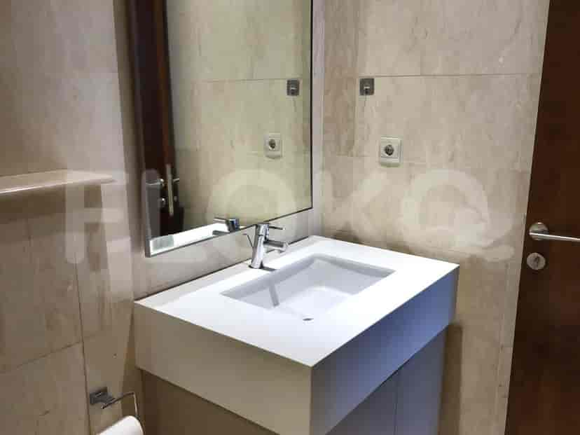 Bathroom with a sink, mirror, and a simple design.