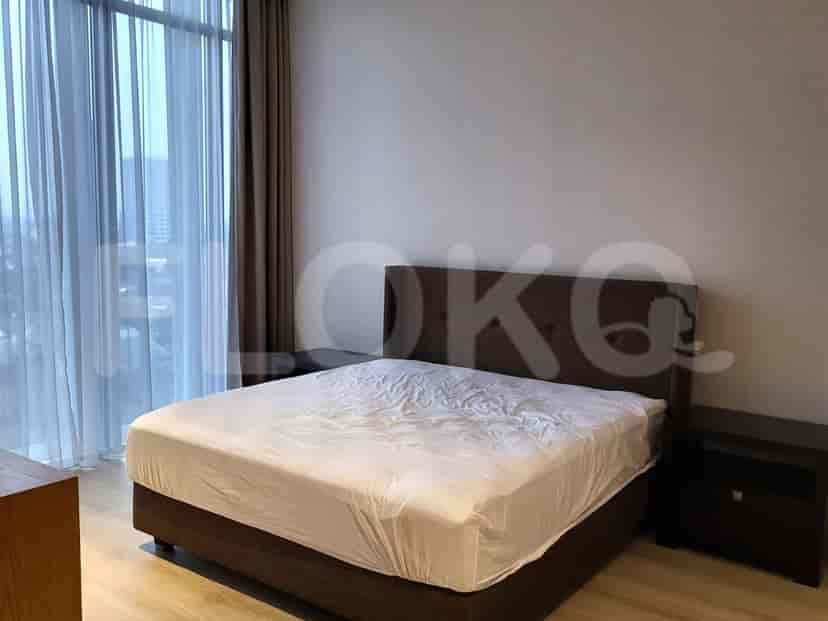 Bedroom with a large bed, nightstands, and a window.