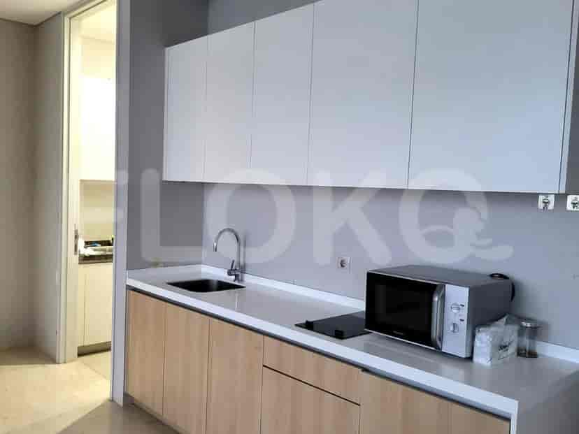 Kitchen area with cabinets, a microwave, and a countertop.