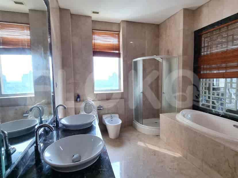A luxury bathroom with a double vanity, bathtub, and shower.