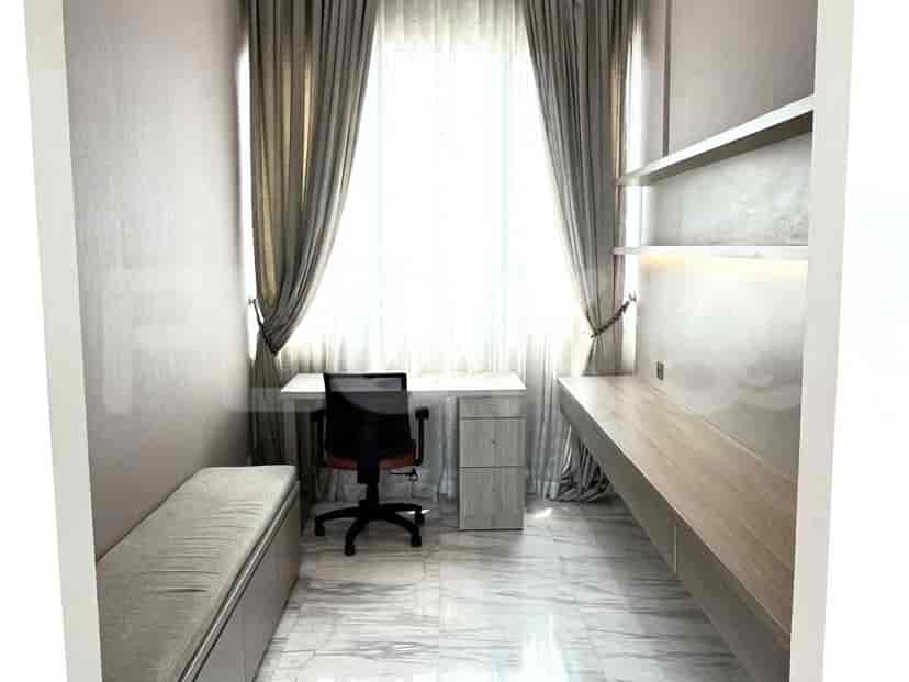 A functional home office space with a desk, chair, and open shelving.
