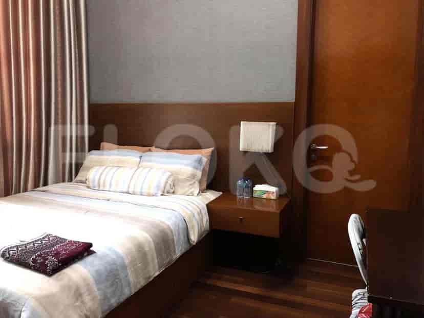Bedroom with double bed and bedside table.