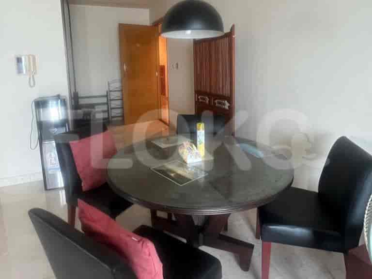 Round dining table with seating for four.