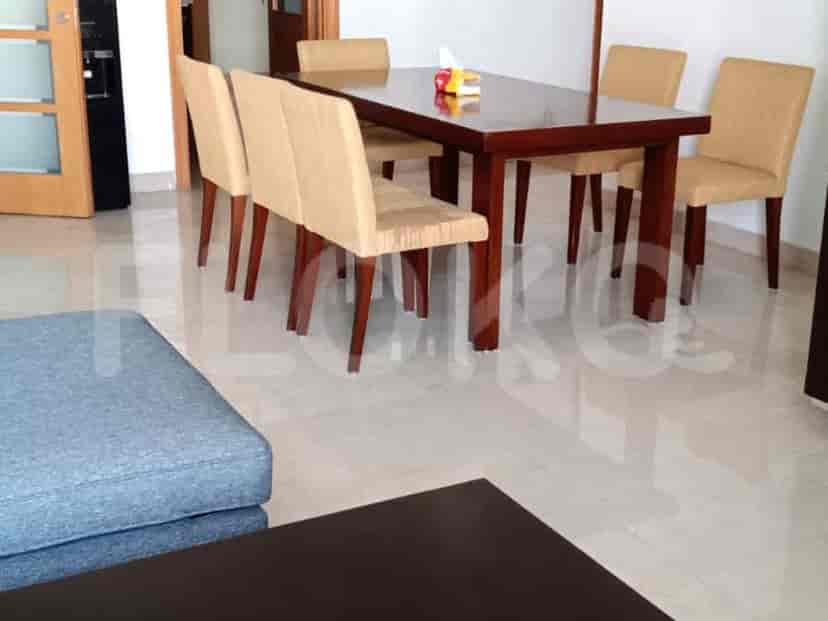 Dining area featuring a wooden table and chairs.