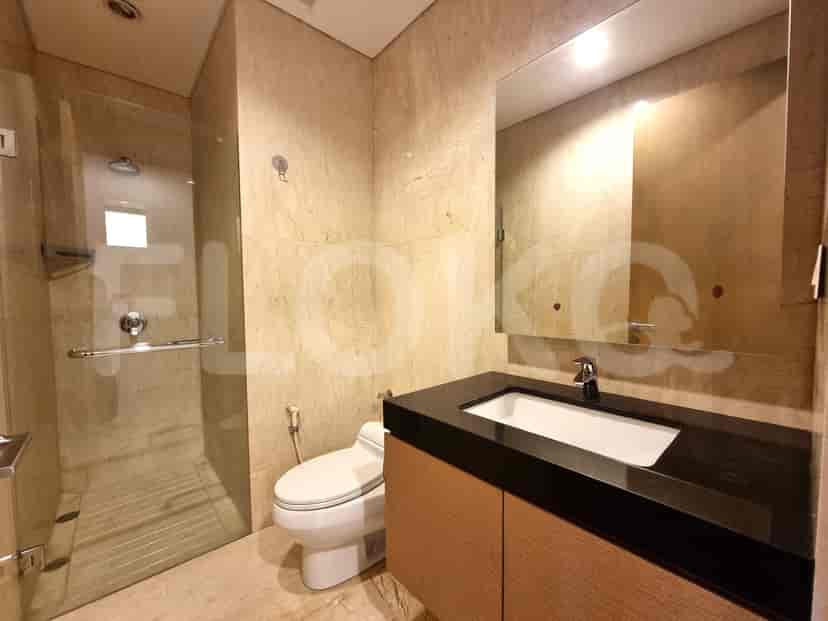 Modern bathroom with a glass-enclosed shower and a vanity.