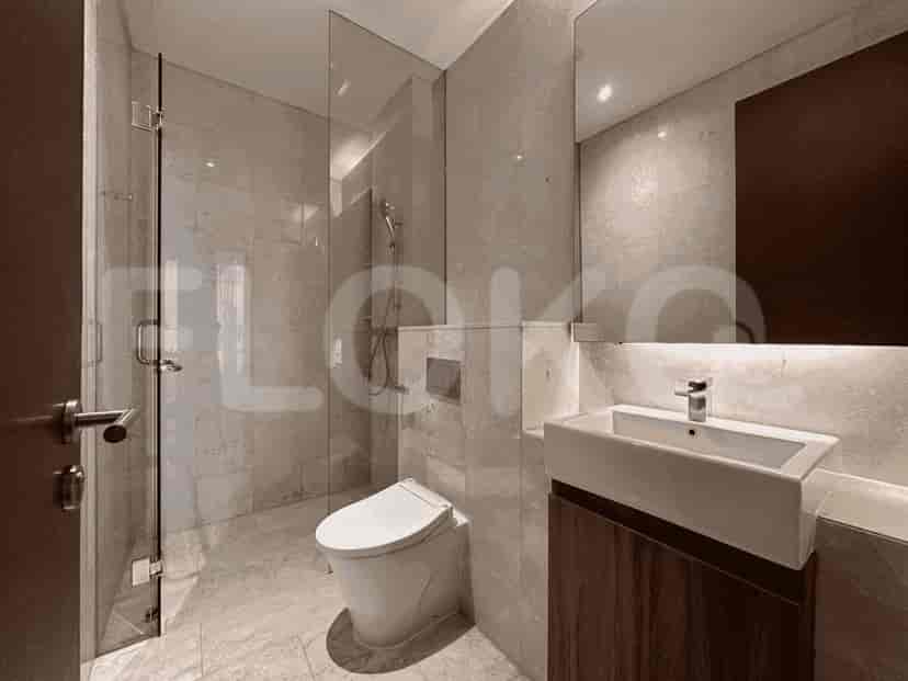 A bathroom featuring a shower and a toilet.