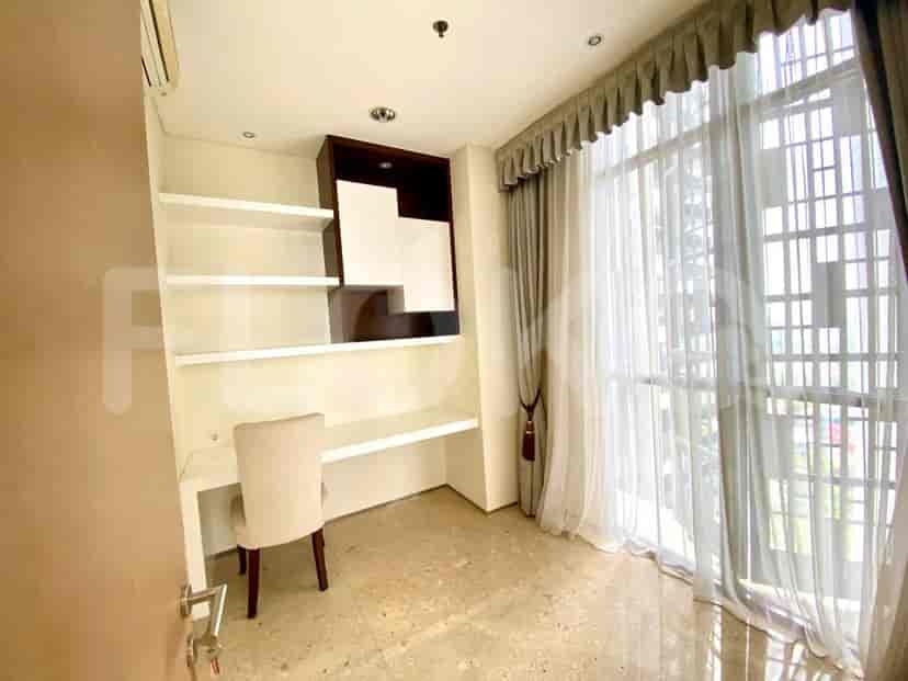 Study area with built-in desk and shelves.