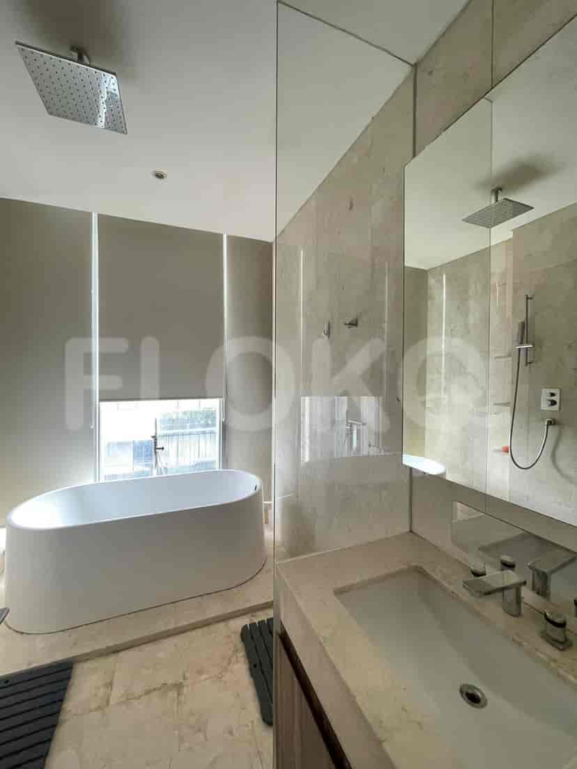Spacious bathroom featuring a bathtub and a shower with a rain shower head.
