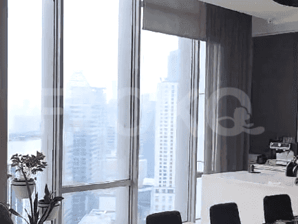 Living room windows with city views.