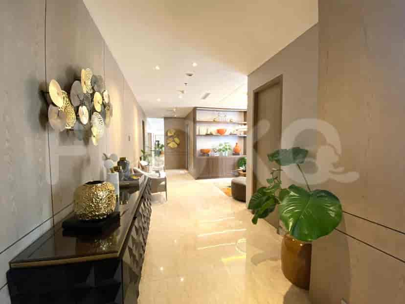 Entrance area with a mirror, side table, and wardrobe.