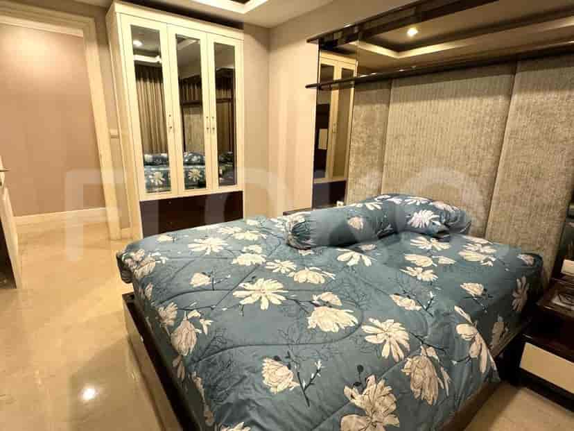 Bedroom with a large bed, mirrored wardrobe, and light blue floral bedding.