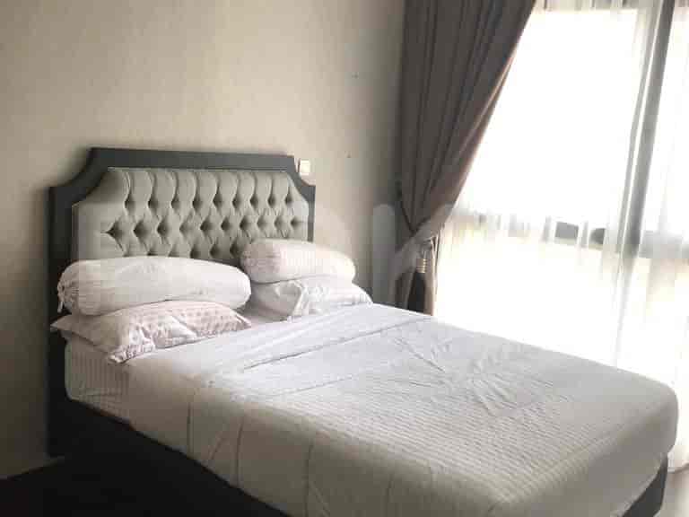 Bedroom with bed and window.
