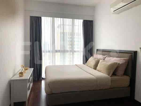 Bedroom with a bed, large windows, and an air conditioning unit.
