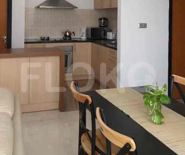 A modern kitchen with wooden cabinets and stainless steel appliances.