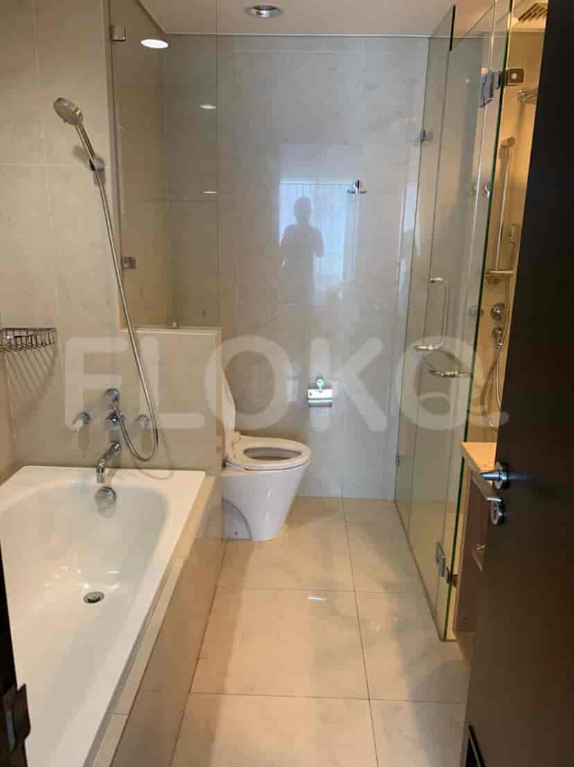A bathroom with a bathtub, a shower, and a toilet.