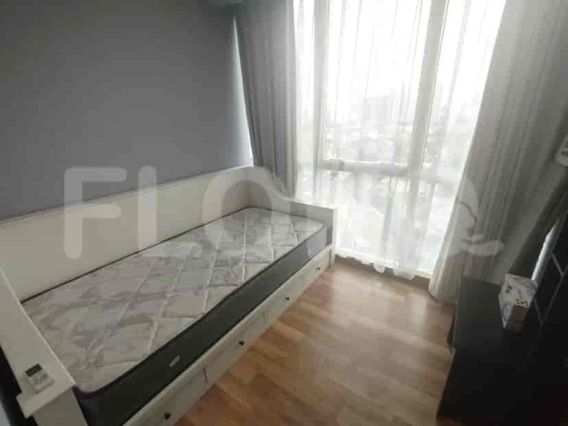Single bed in a modern styled bedroom.