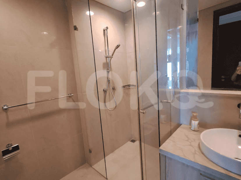 Bathroom featuring a walk-in shower and vanity.