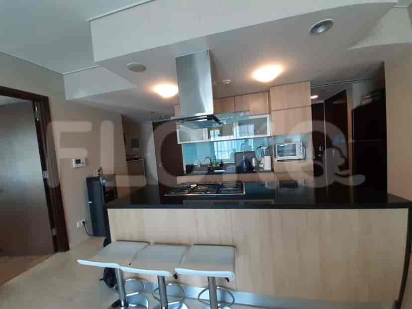 Modern kitchen with sleek cabinetry, a breakfast bar, and stainless steel appliances.