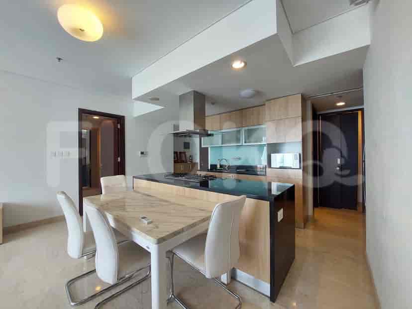 A kitchen with a dining area and an island.