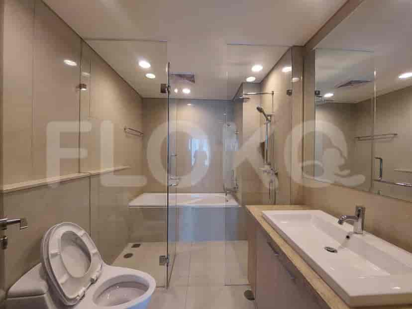A modern bathroom with a glass-enclosed shower and bathtub.