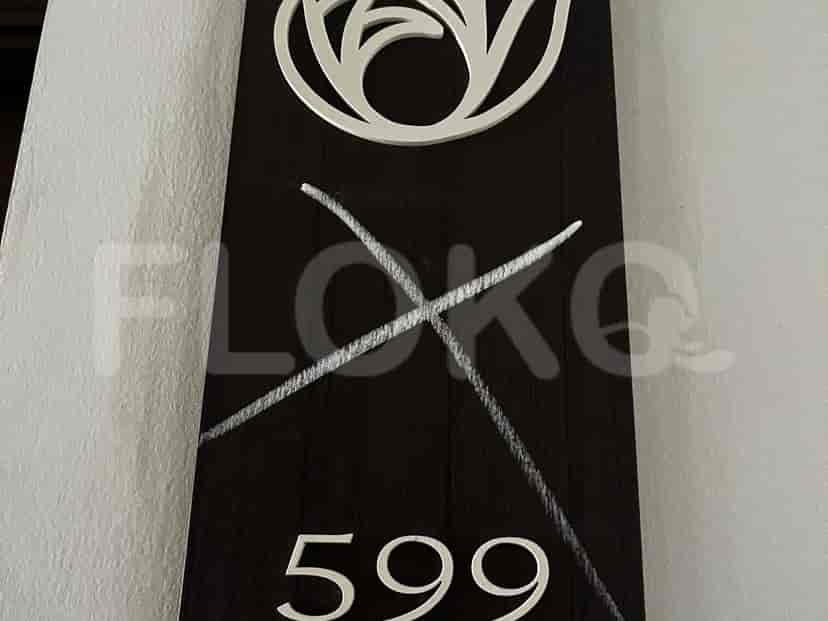 A sign with the apartment number 599.