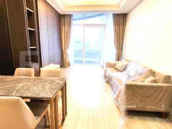 Living room with a dining table and sofa.