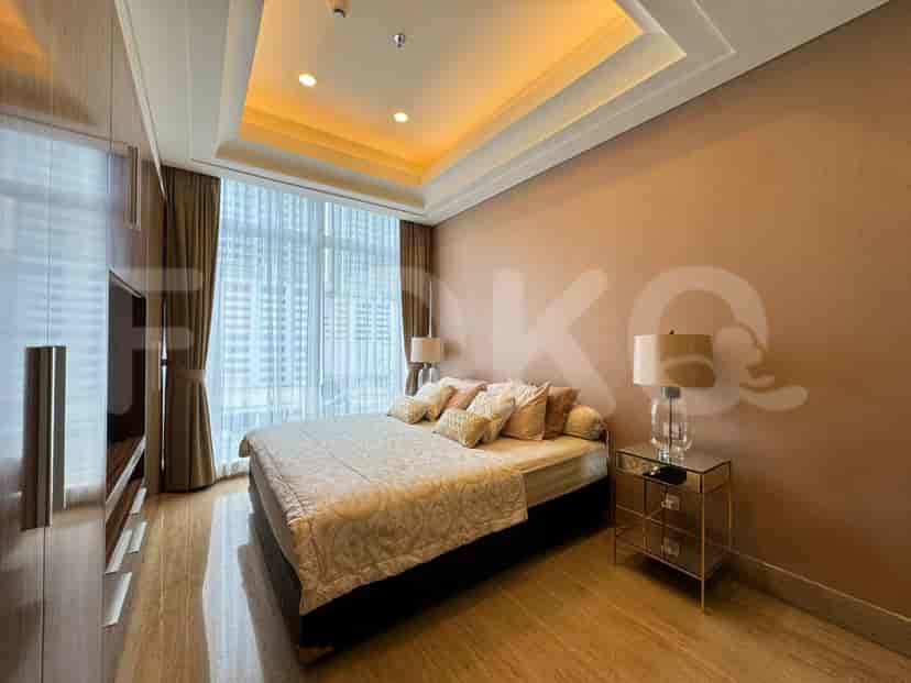 Another view of the master bedroom with a large bed, built-in closet, and large windows with city view.