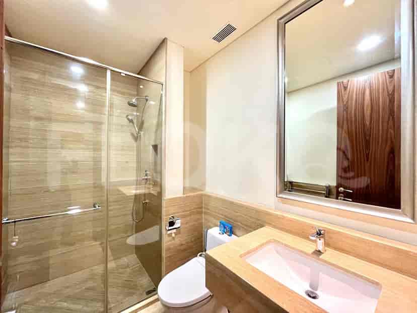 Bathroom with a walk-in shower, sink, and toilet.