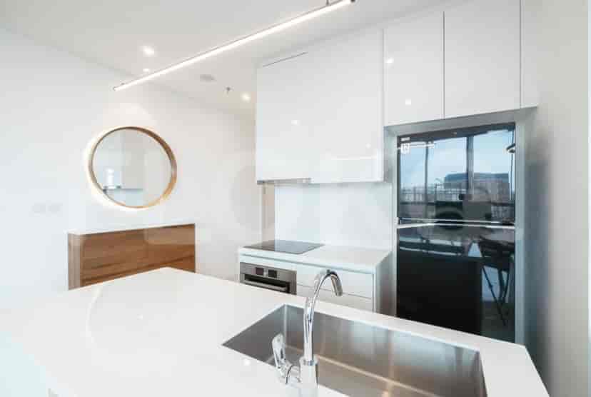 Close-up of the kitchen with a white kitchen island and modern appliances.