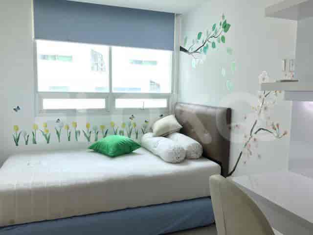 Bedroom with a bed, a window, and decorative wall stickers.