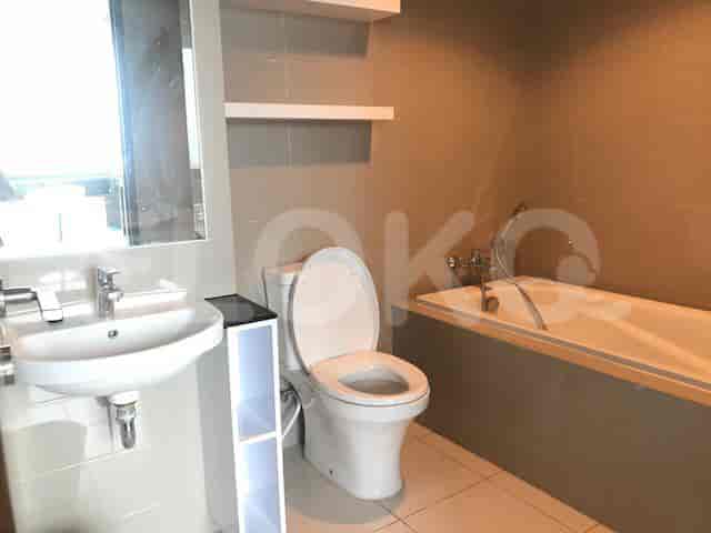 Bathroom with a toilet, sink, and bathtub.