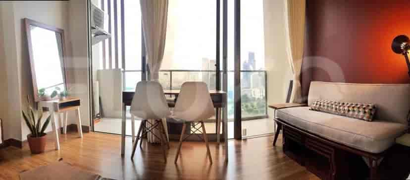 Living room with balcony view and dining table