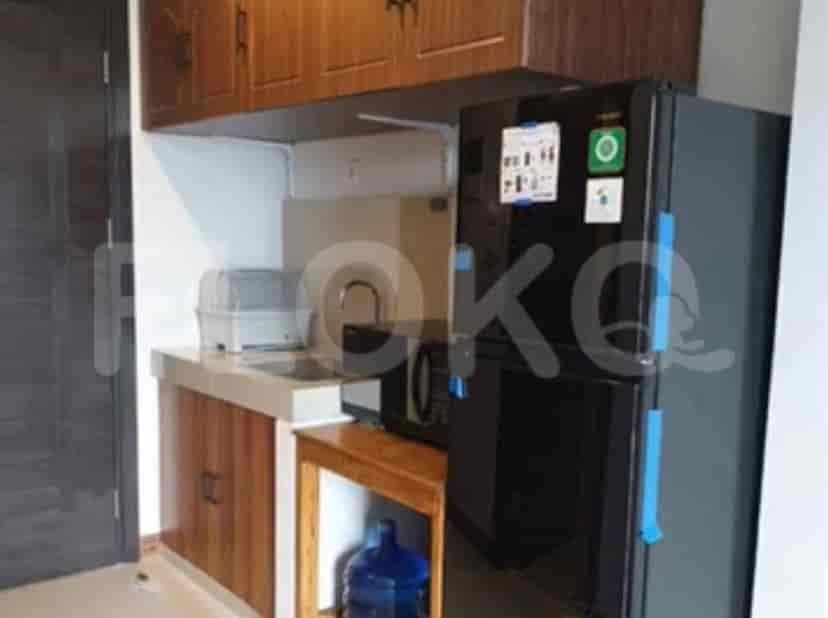 A compact kitchen setup with essential appliances.