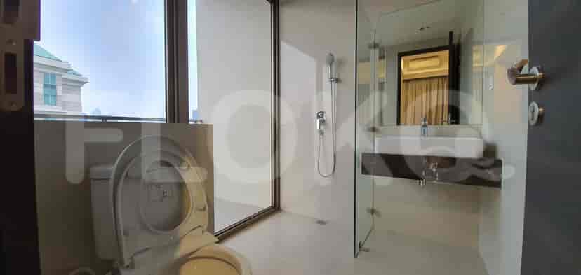 Spacious bathroom with a shower, a sink, and a large mirror.