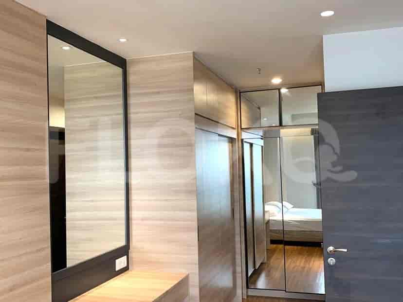 A spacious dressing area with mirrors and a closet.