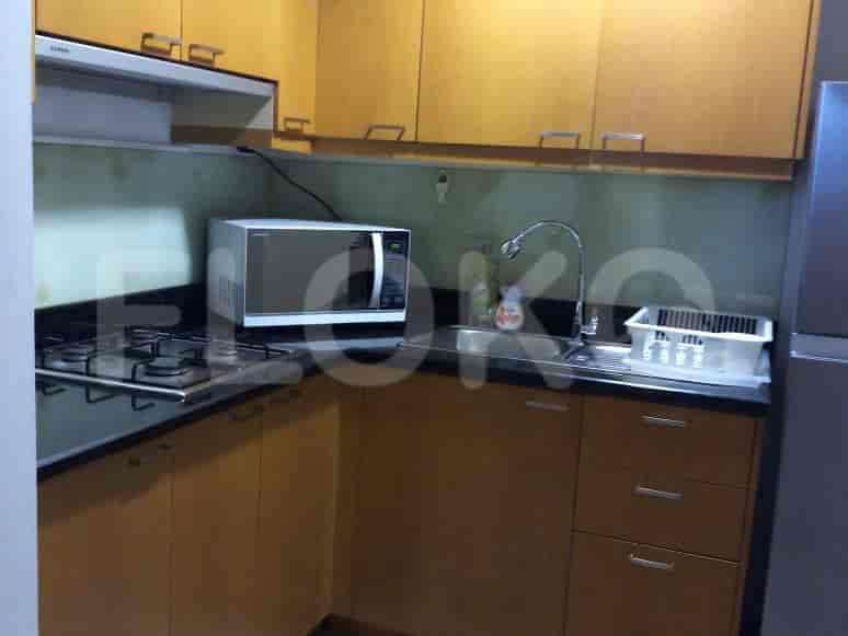 A compact kitchen with a microwave and cabinets.
