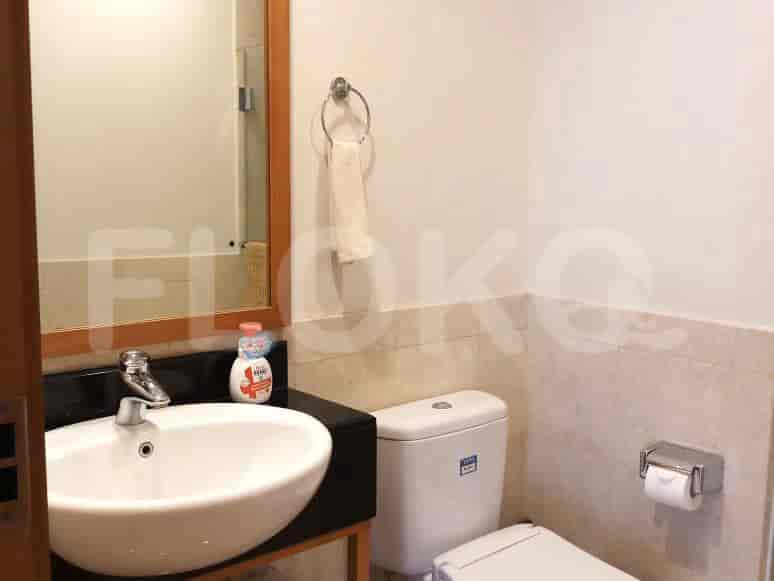 A bathroom with a wash basin and toilet.