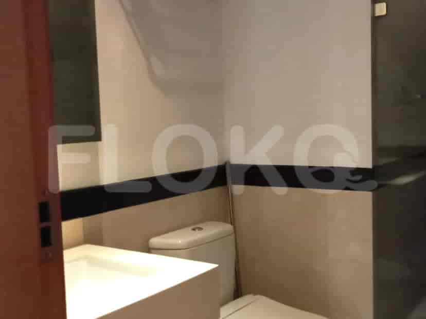 Modern bathroom with a toilet and sink.